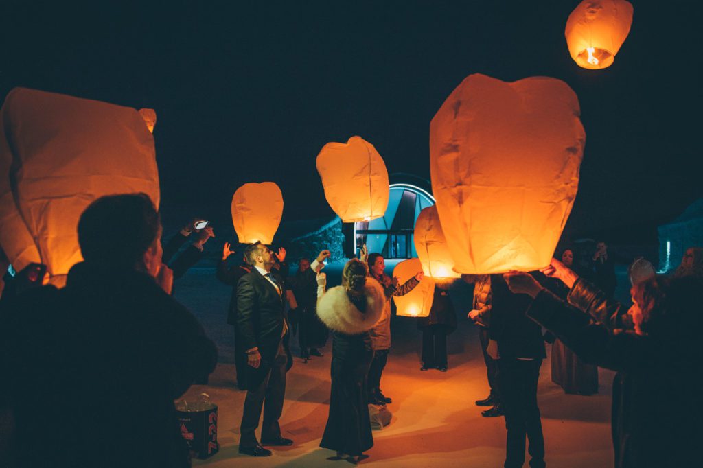 Wedding guests release lanterns