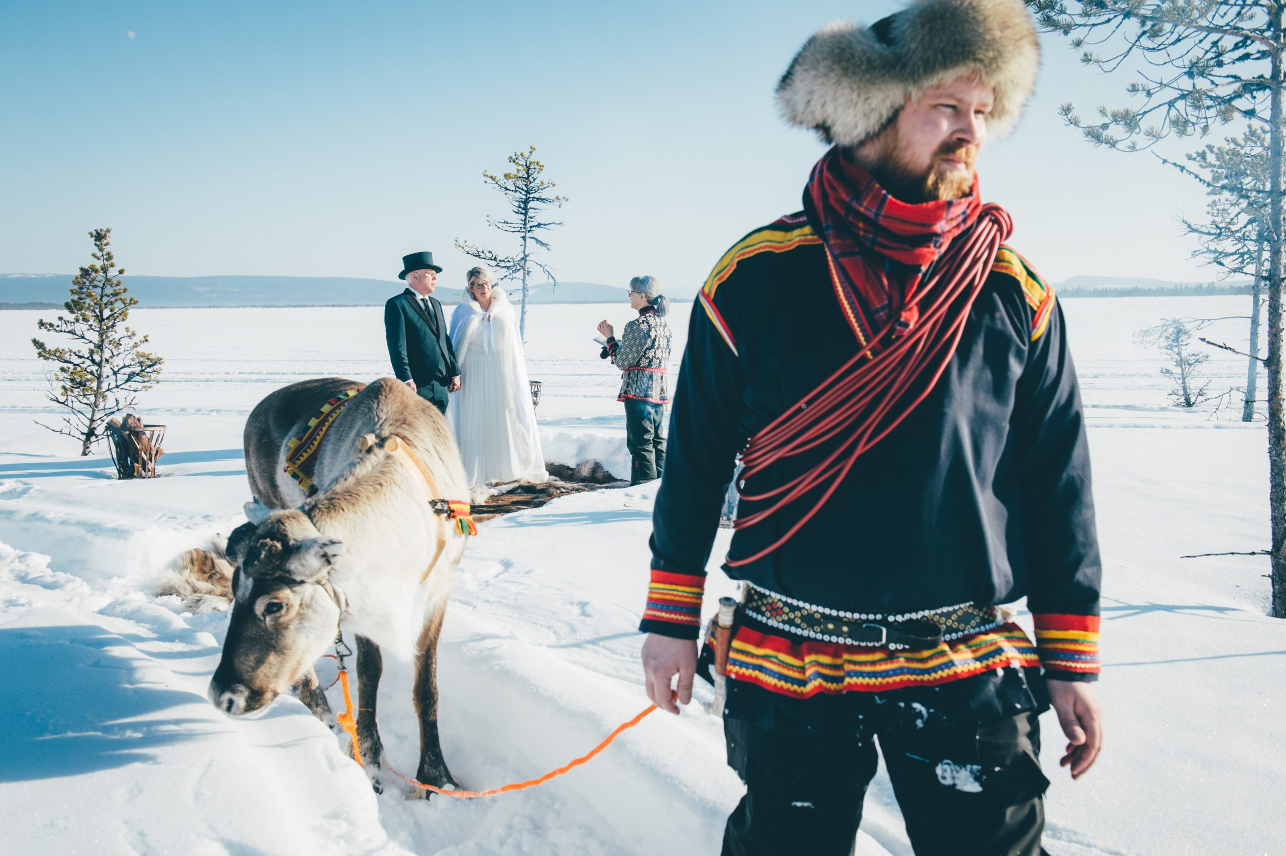 A Sami guide bring a couple to their wedding in the wilderness